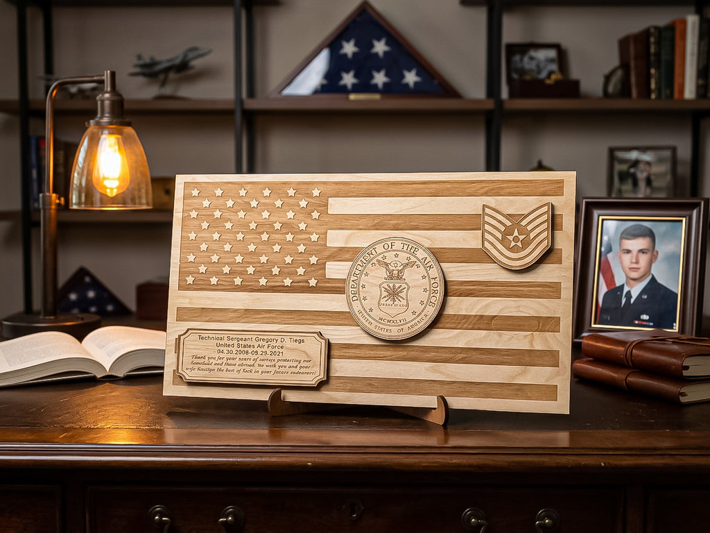 A wooden American flag wall plaque with engraved U.S.